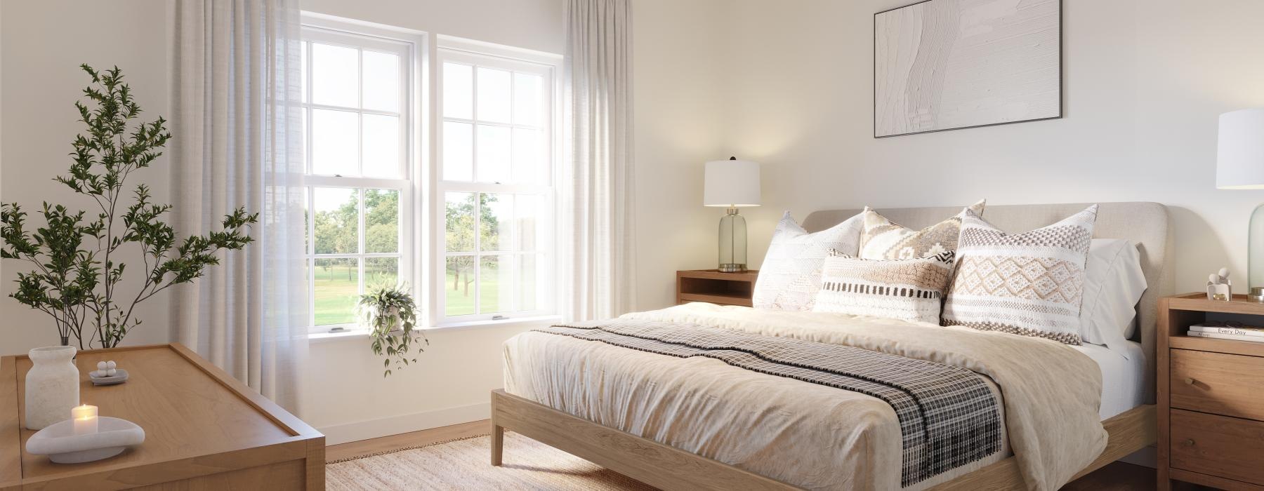 a bedroom with a bed and a plant